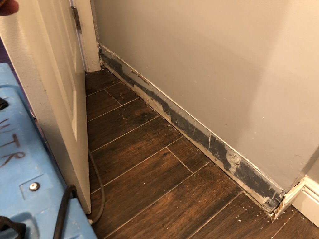 Baseboards removed after water intrusion.
