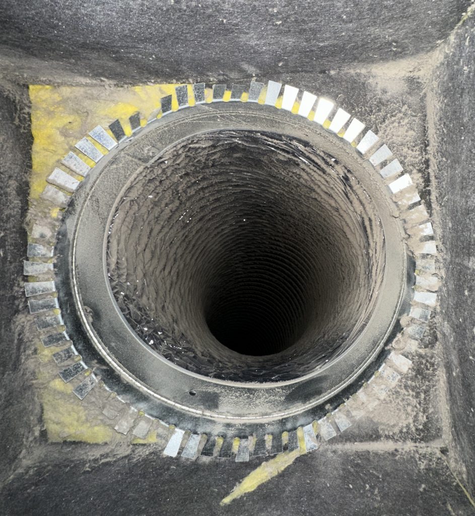 A duct system with extensive amounts of dust inside.